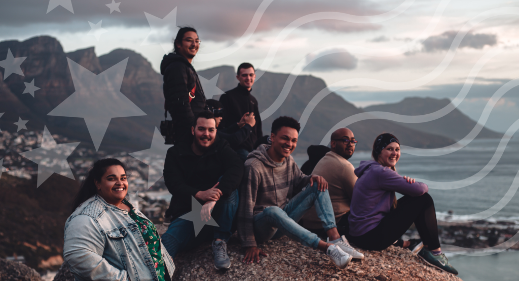 Diverse group of people on a mountain top